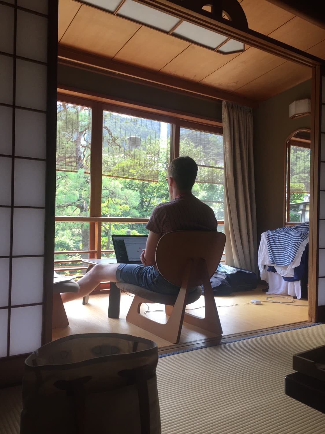 Image of Simon Last facing a window in the Kyoto flat he and Ivan Zhao rented the year they rebooted Notion
